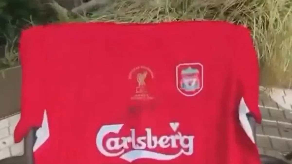 Liverpool FC jersey displayed outdoors on a chair
