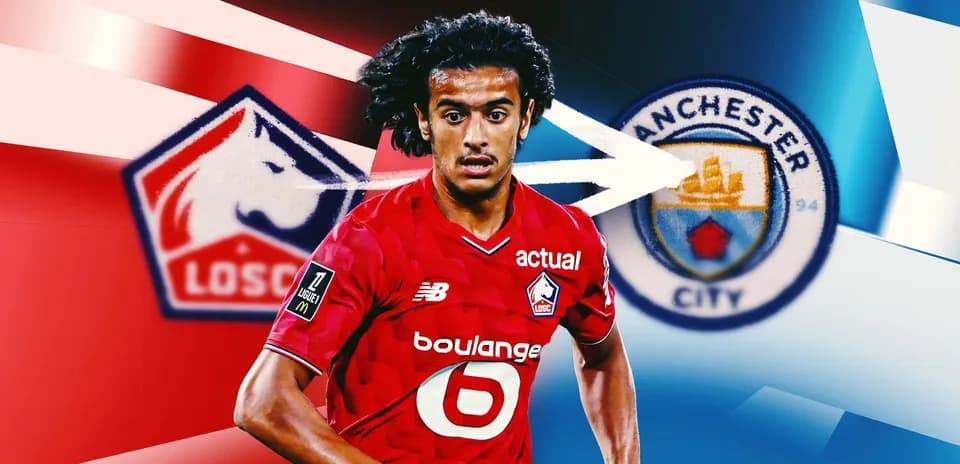 Игрок Лилля с логотипами LOSC и Манчестер Сити